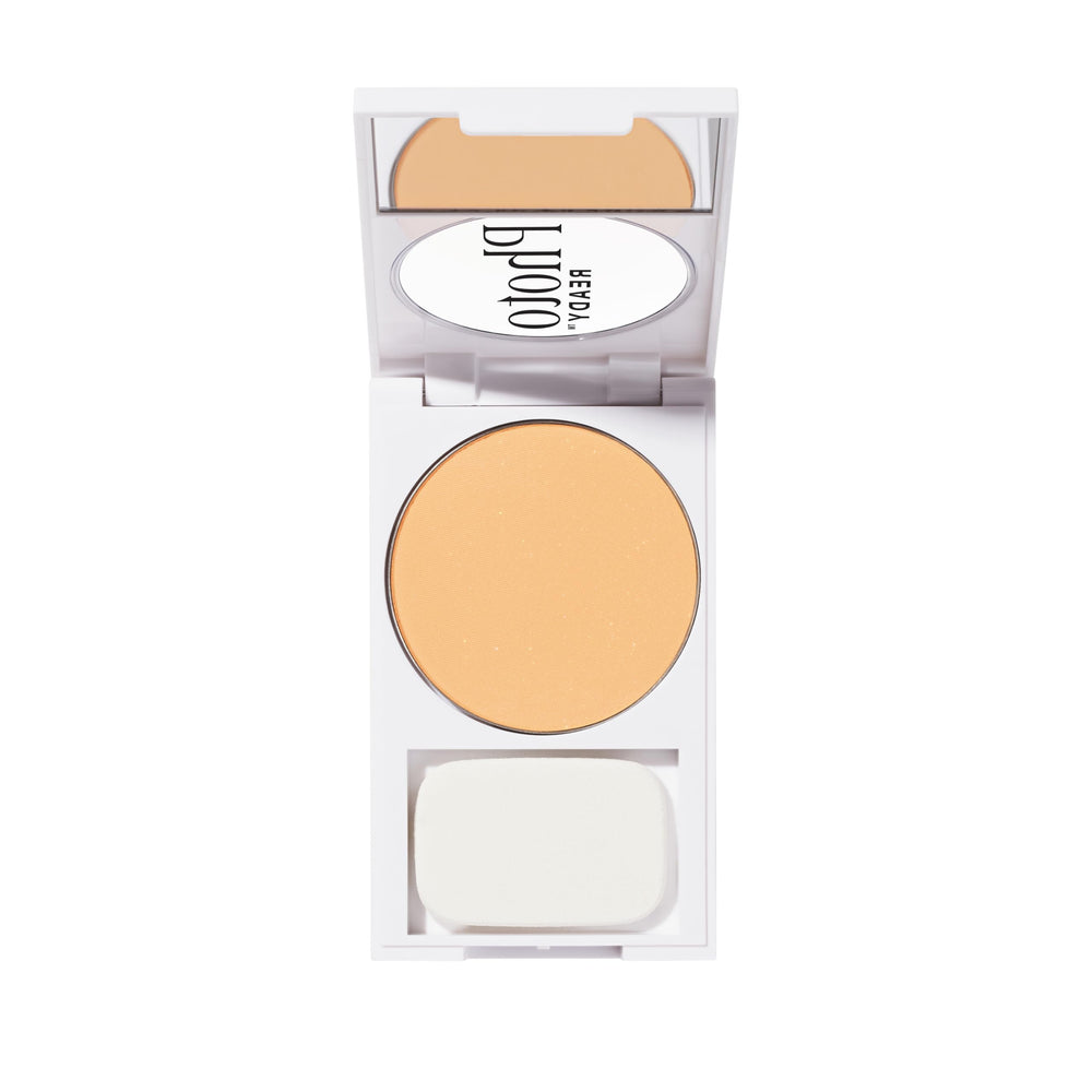 Revlon compact held in hand to show scale and travel-friendly convenience