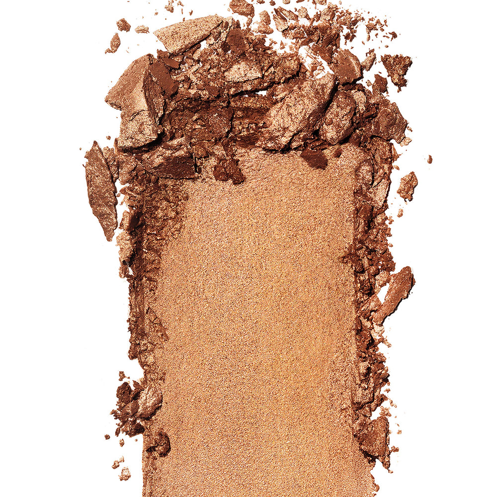 Revlon Skinlights bronzer open pan close-up of silky texture highlighting prismatic pigments