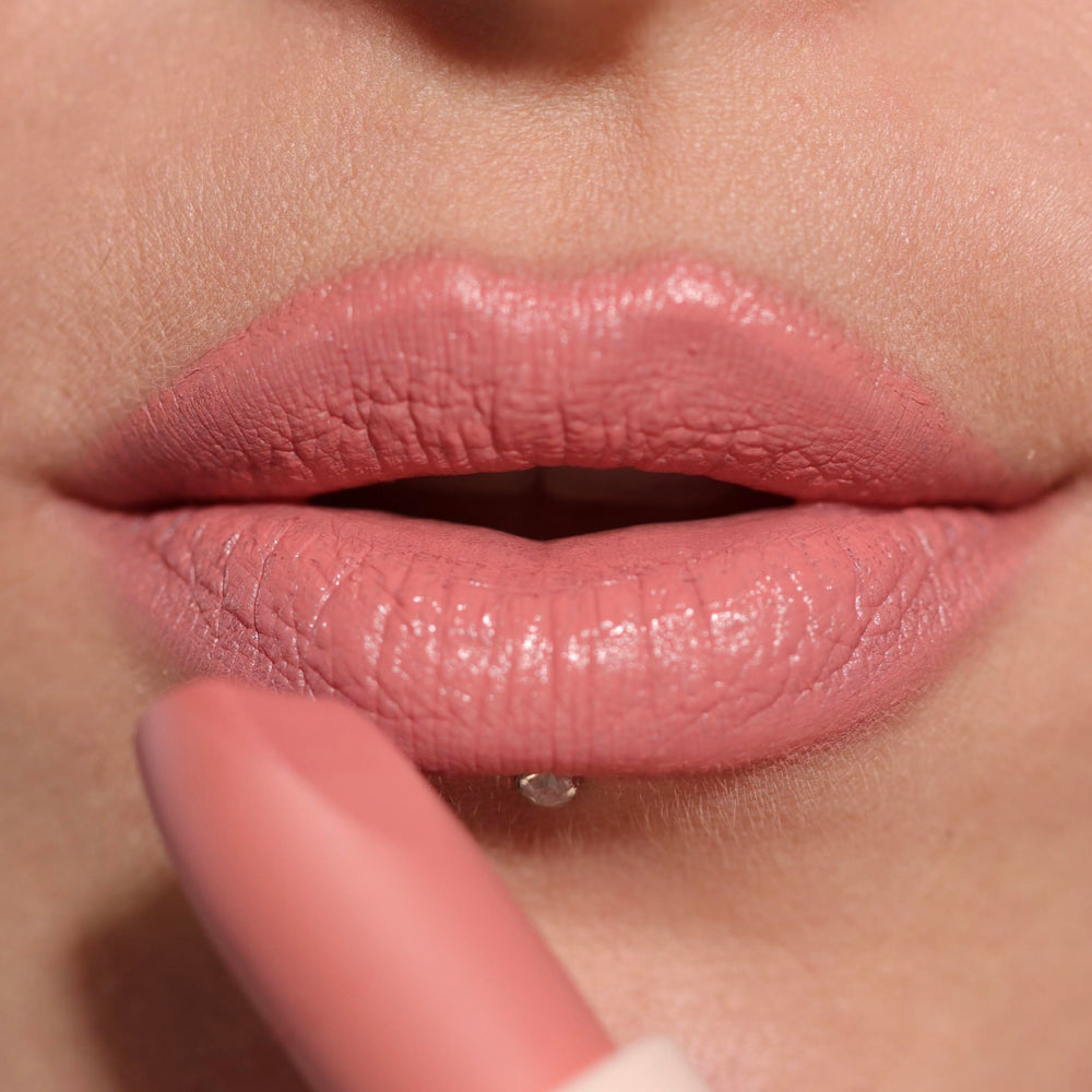 Revolution Lip Allure open tube with cap detail showing compact travel-friendly design