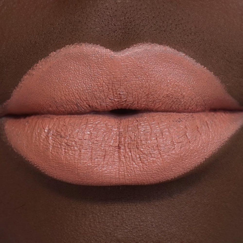 Revolution Beauty London swatch on arm displaying rich Wifey shade and true-to-pigment payoff