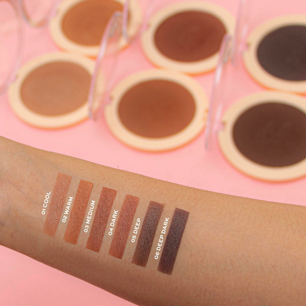 Revolution Mega Bronzer brush application on cheek demonstrating buildable sculpting benefit