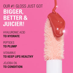Revolution Pout Bomb applied on lips in light mauve for plumper shine