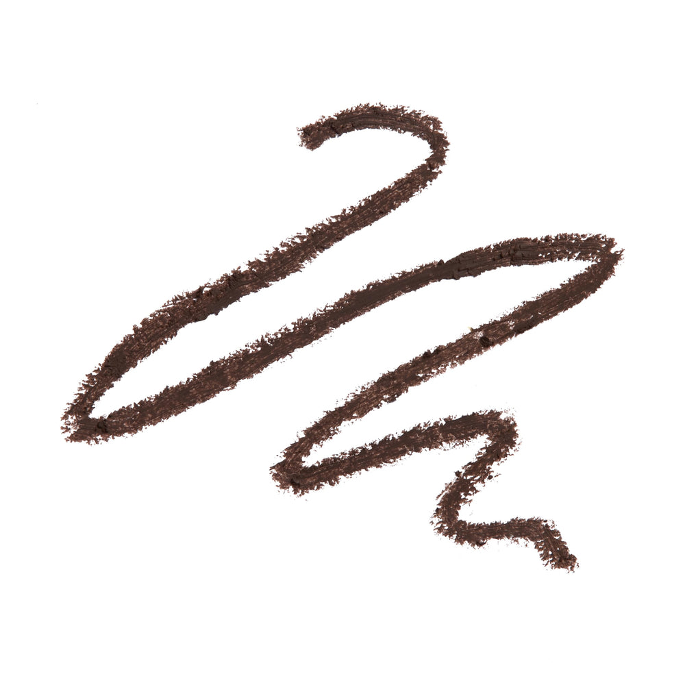 Revolution Beauty London pencil held in hand to show travel-friendly size and easy on-the-go touch-ups