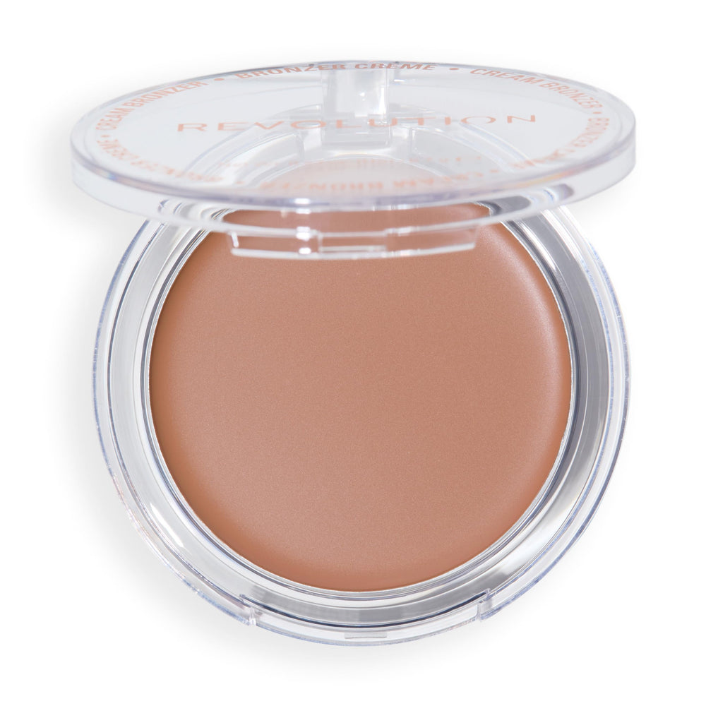 Revolution Beauty London compact held in hand showing portable size and travel convenience