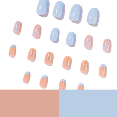 Rhspayh nails in hand showing short almond scale for practical daily wear