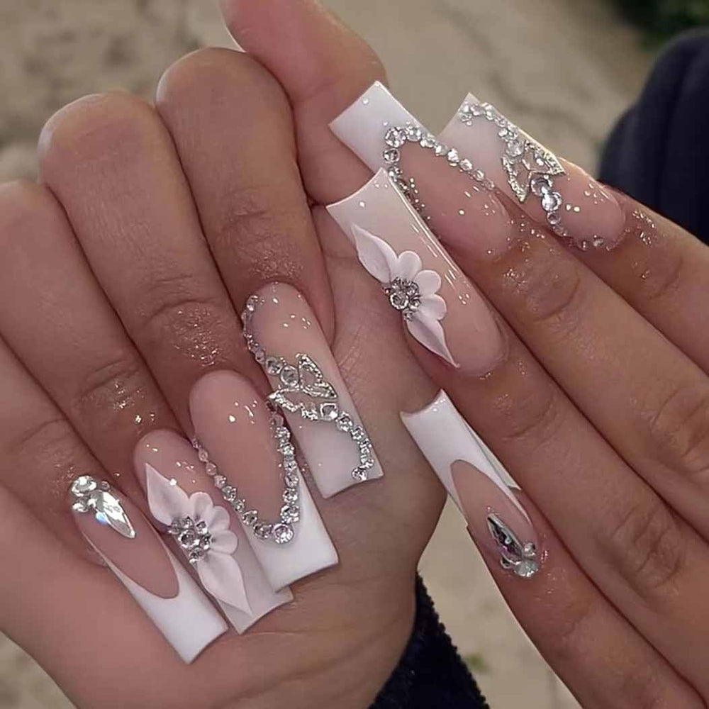 RikView front view of 24-piece French tip set showing glossy 3D flowers and included accessories, convenient