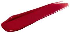 Rimmel Provocalips next to a coin showing compact size and portability