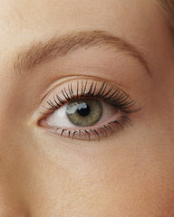 Rimmel Wonder'Extension tube beside everyday items showing compact travel size benefit