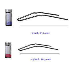 ROCST pin held in hand to show scale and ease of placement for styling