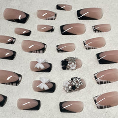 ROFIBUT on hand model displaying finished manicure ready for events