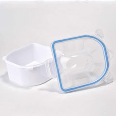 Rolabling bowls beside a credit card for size comparison showing portable manicure sizing