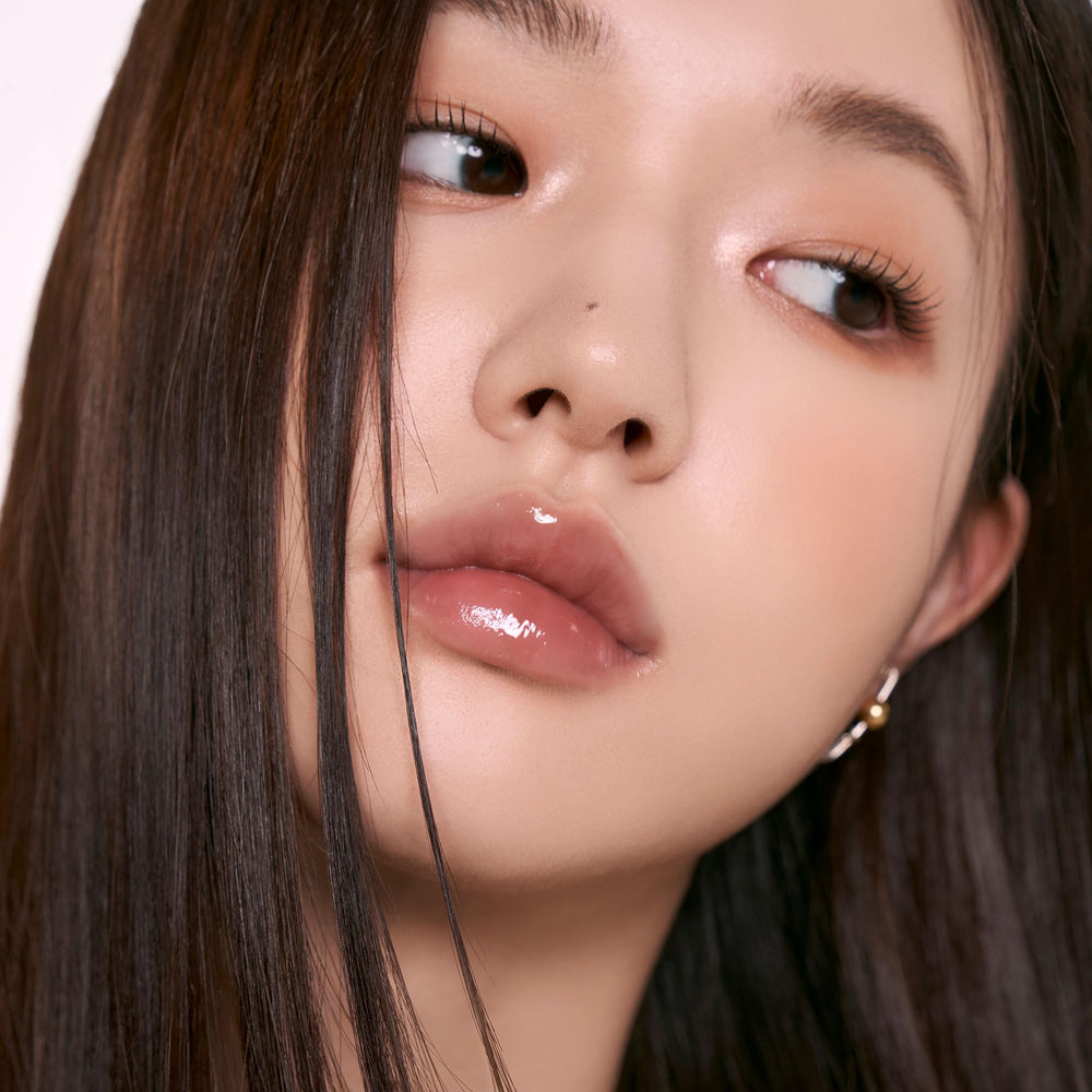 rom&nd gloss in styled makeup flatlay showing versatile wear and lifestyle appeal