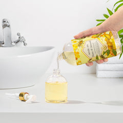 ROMIIE ZOI bottle next to a kitchen sink showing convenient home use benefit