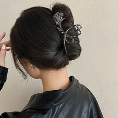 ROMODIYA worn by woman in a loose updo demonstrating strong grip