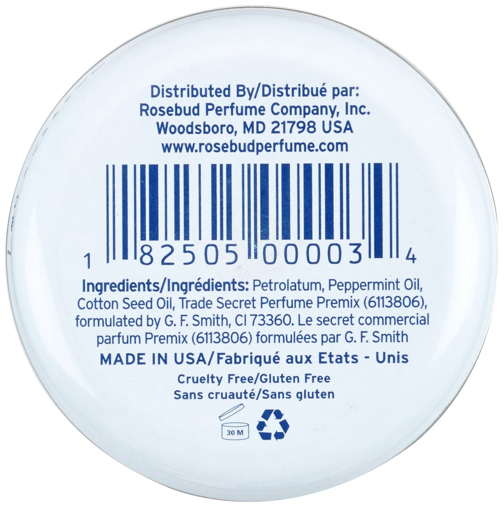 Rosebud Perfume tin in a handbag showing portability and on-the-go moisture benefit