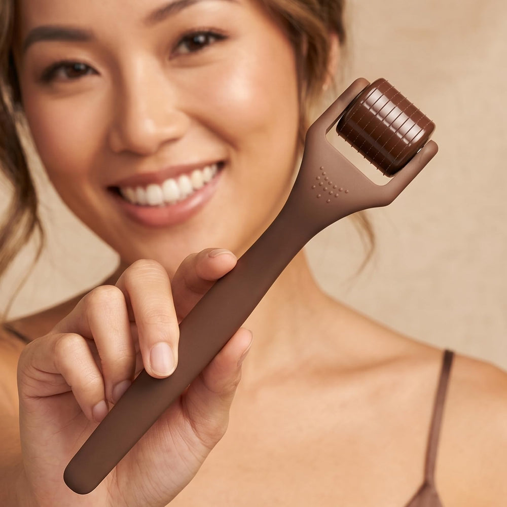 ROSELYNBOUTIQUE derma roller being used on jawline illustrating easy at-home use