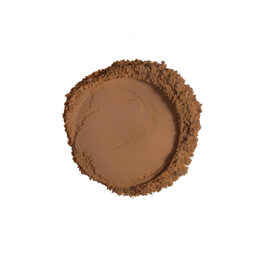 Ruby Kisses powder applied with brush demonstrating blendable coverage benefit