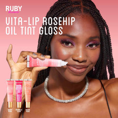 Ruby Kisses size comparison next to coin showing compact travel-friendly tubes