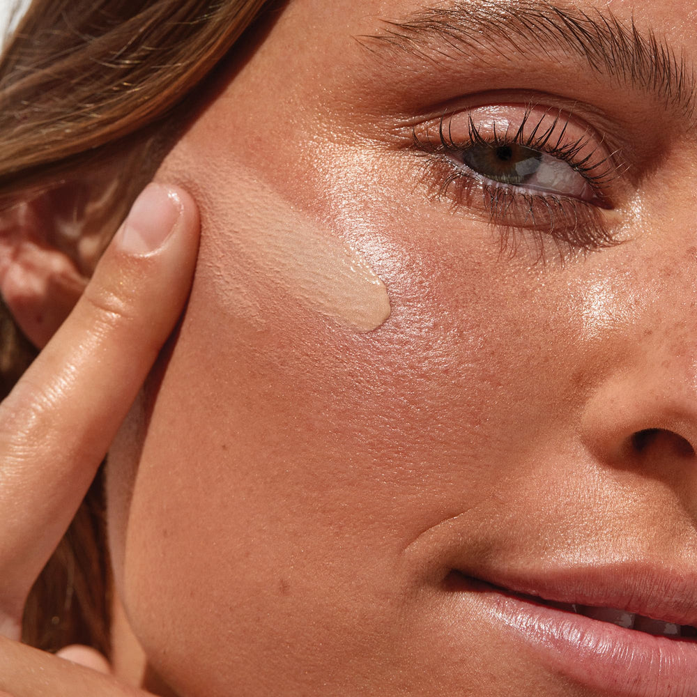 Saie Sunvisor being applied to face for hydrated, protected complexion