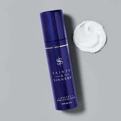 Saints & Sinners applying potion to damp hair for heat protection benefit