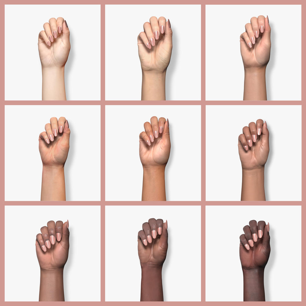 Sally Hansen painted nails hand shot demonstrating natural-looking nude and polished benefit