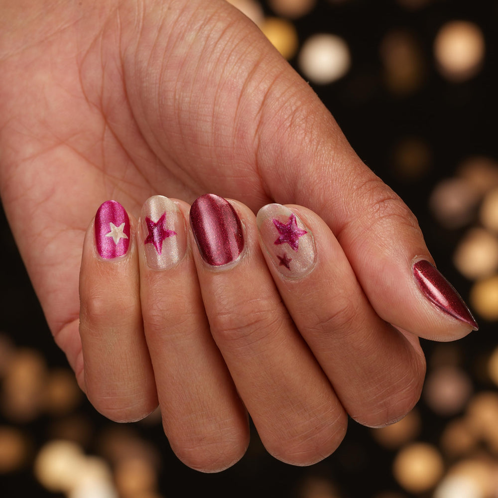 Sally Hansen bottle held in hand to show size and easy-at-home use