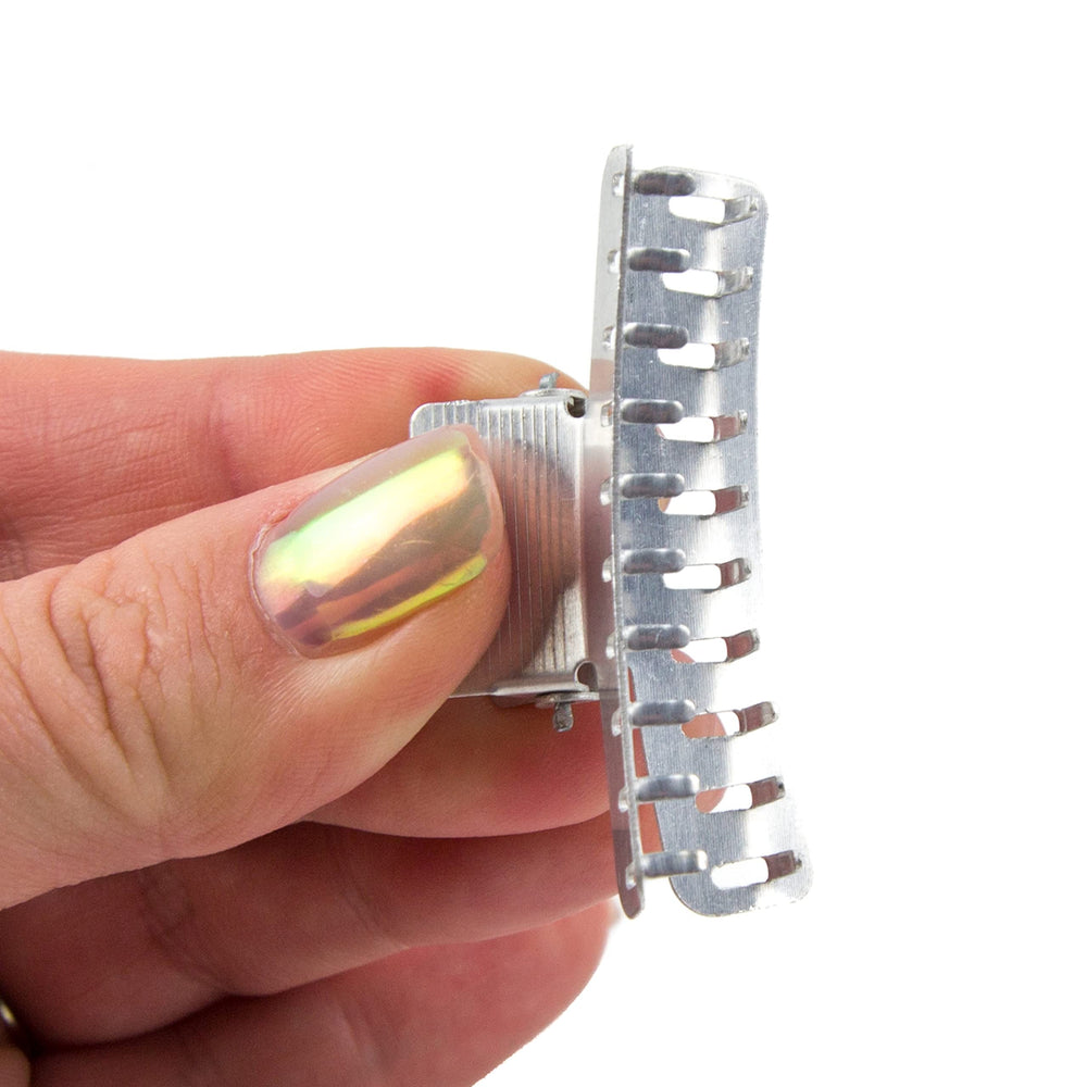 Salon Supply Co clips securing finger waves on model for precise drying and hold