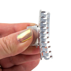 Salon Supply Co clips securing finger waves on model for precise drying and hold