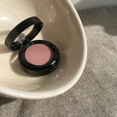 Sandstone Scandinavia 414 Light Rose compact opened to reveal pan and travel-ready design benefit
