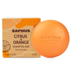 SAPHUS front packaging showing travel-size solid shampoo, eco-friendly benefit