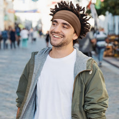 SATINIOR model wearing cap side profile keeping dreads neat and protected