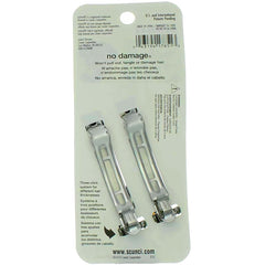Scunci barrette beside a coin showing compact size and easy portability advantage