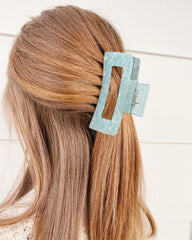 Secroma styled half-up look on model showing fashion-forward, secure hold