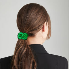 Semato scrunchie holding ponytail showing secure hold and low creasing benefit protects hair
