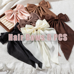 Seneeel bow worn in a high ponytail demonstrating bold look and easy application benefit instant style