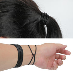 Senkary bracelets scattered on party table as favors, bright bulk supply for events