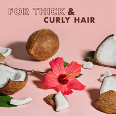 SheaMoisture bottle label detail highlighting natural ingredient benefits