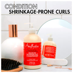 SheaMoisture 13 oz conditioner held in hand showing size and easy dispensing