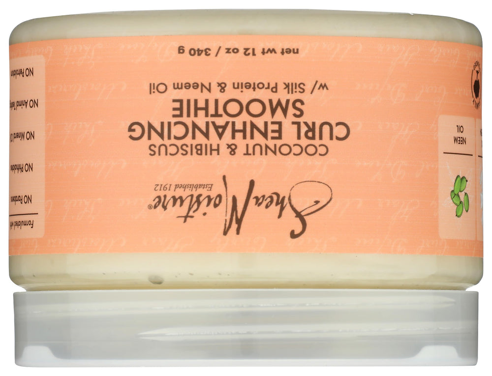 SheaMoisture jar held in hand to show 12 oz scale and easy handling benefit