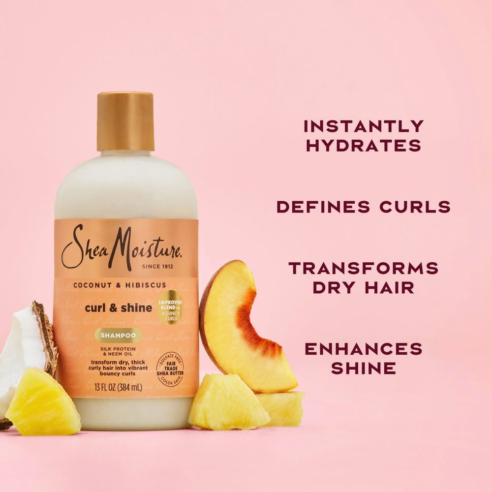 SheaMoisture bottle held in hand showing product size and easy dispensing