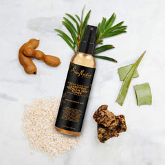 Shea Moisture facial mist sprayed on model for quick refresh