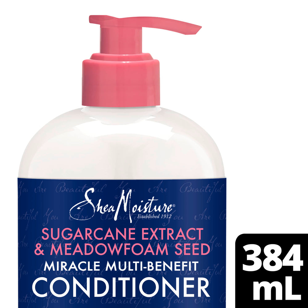 SheaMoisture creamy conditioner texture close-up, demonstrates slip and smooth application