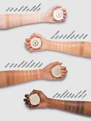 SHEGLAM balm held in hand to show compact size and travel-friendly scale