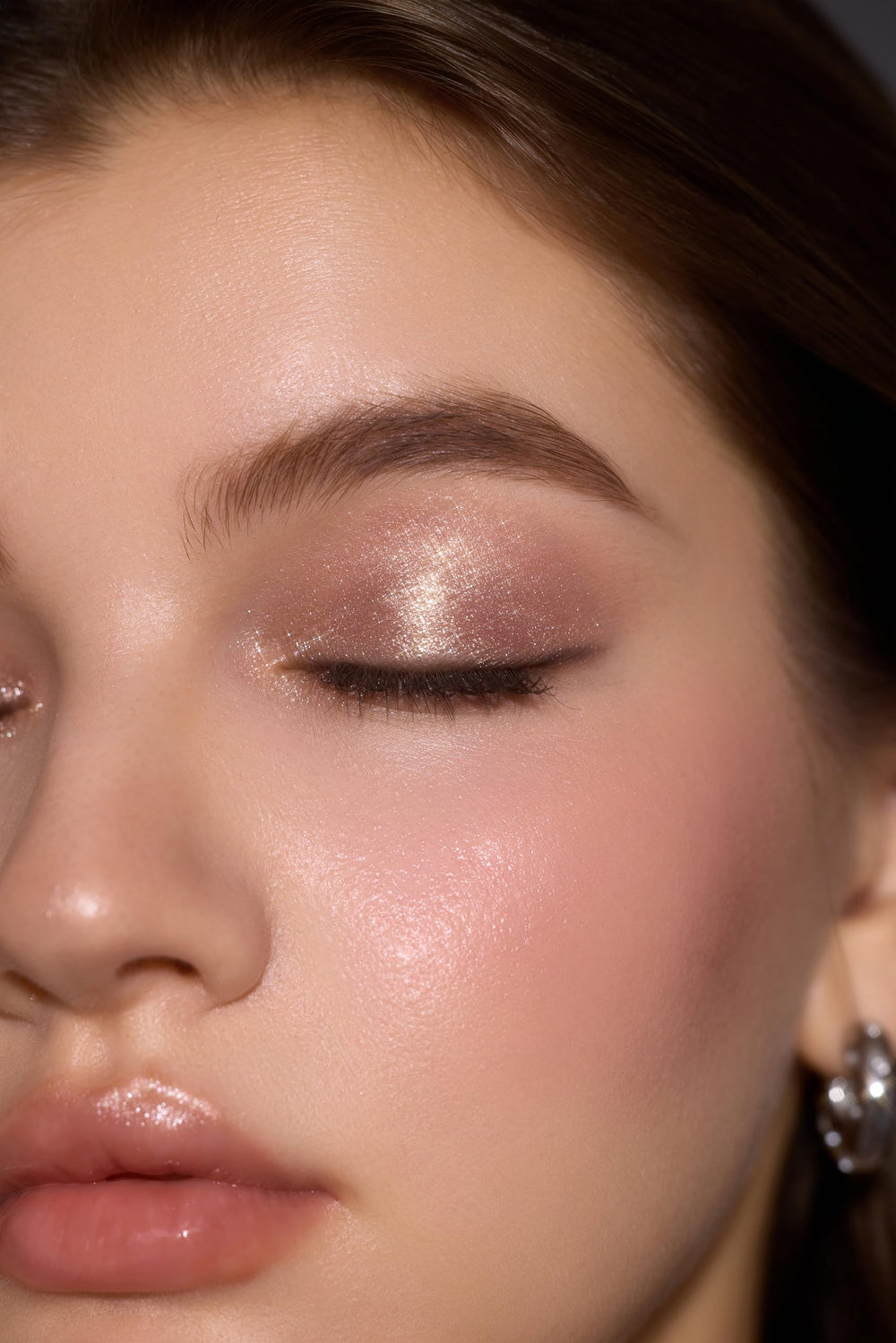 SHEGLAM applied on eyelid in lifestyle scene adding instant lift and sparkle