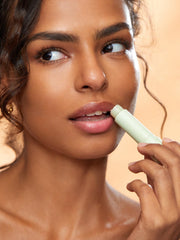 SHEGLAM Pout PHresh Avocado applied on hand in lifestyle shot benefit: natural personalized color