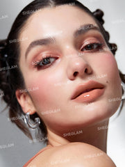 SHEGLAM close-up of solid gloss texture highlighting smooth, non-sticky finish