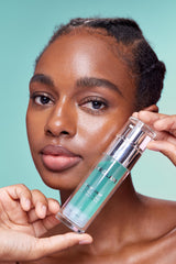 SHEGLAM primer next to everyday items showing portable size benefit