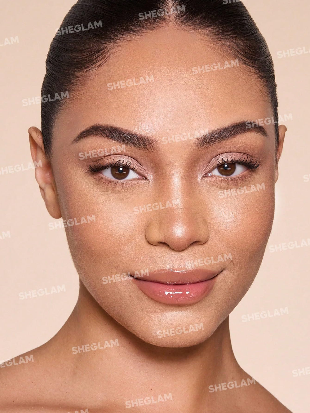 SHEGLAM foundation stick beside a coin showing compact travel size benefit