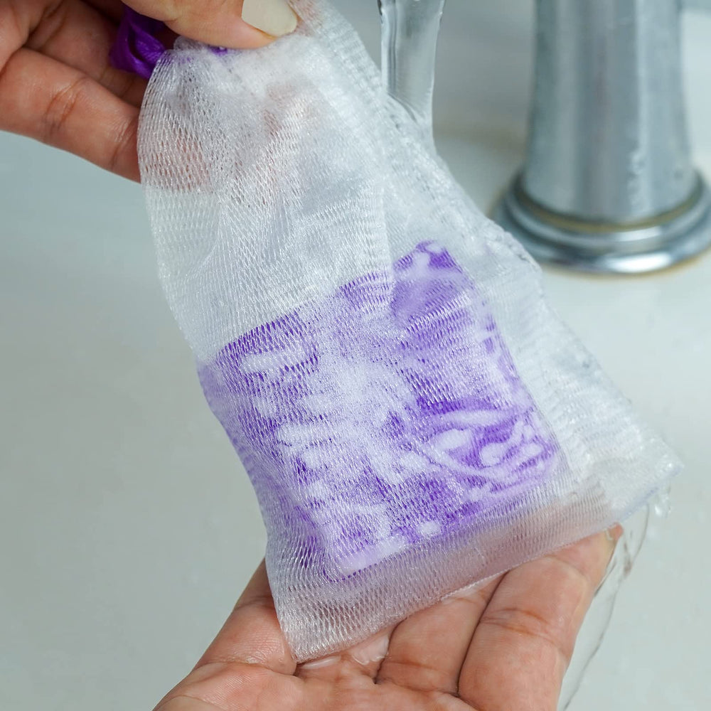 Shibarcle soap beside a hand for size comparison and convenient daily use