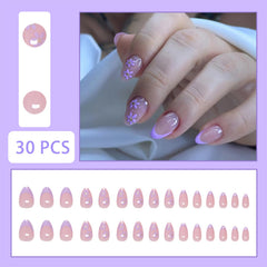 SHIQIXIANNV close-up of purple floral nail art highlighting delicate petal details